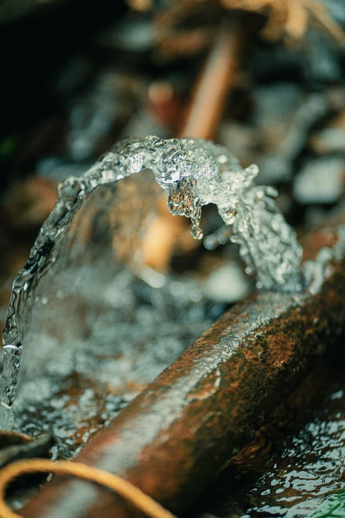 Burst pipe spraying water